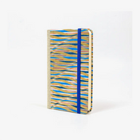 Blaupause-Notizbuch-Format-9x14cm-192Seiten-mit-Chiyogami-bezogen-Motiv-Cover-blau-gold-rot-gewellte-Streifen-Buch-seitlich-von-vorn