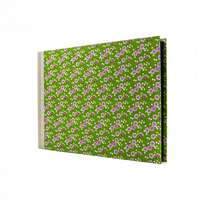 Fotoalbum-24x35cm-60seiten-schwarzer_Fotokarton-mit-chiyogamipapier-bezogen-Muster-Bluetenzweig-auf-gruen-seitlich-von-vorn-2