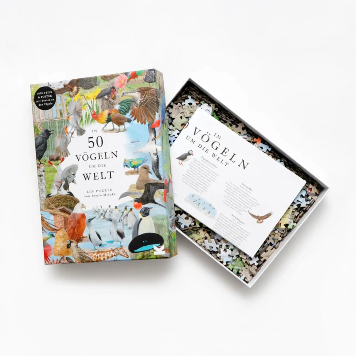 In-50-Voegeln-um-die-Welt-1000-teilige-puzzle-box-geoeffnet-mit-inhalt