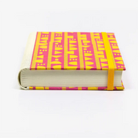 Notizbuch-12x16.5cm-256seiten-recy-Papier-cover-Lokta-Papier-motiv-geometrischeFormen-gelb-auf-magenta-liegend