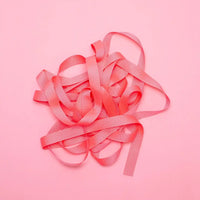 Ripsband-Breite-16mm-laenge-5m-Farbe-NEonpink-Ausgerollt-auf-farbigen-untergrund-Produktansicht-1