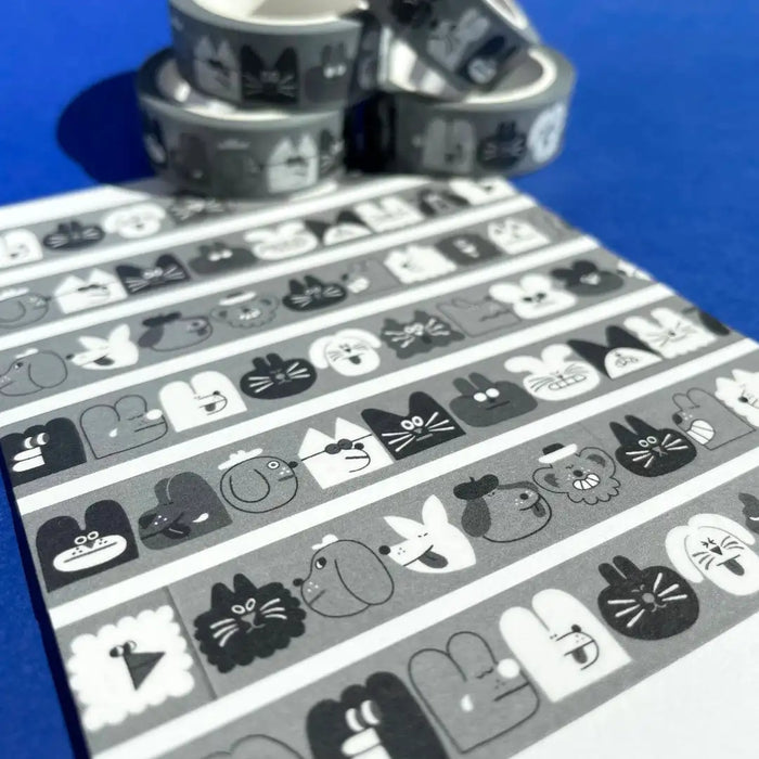 YUK-FUN-Gesichter-schwarz-weiss-Washi-Tape-15mmx10m-Produktansicht-32-Motive-auf-ein-PApier-geklebt