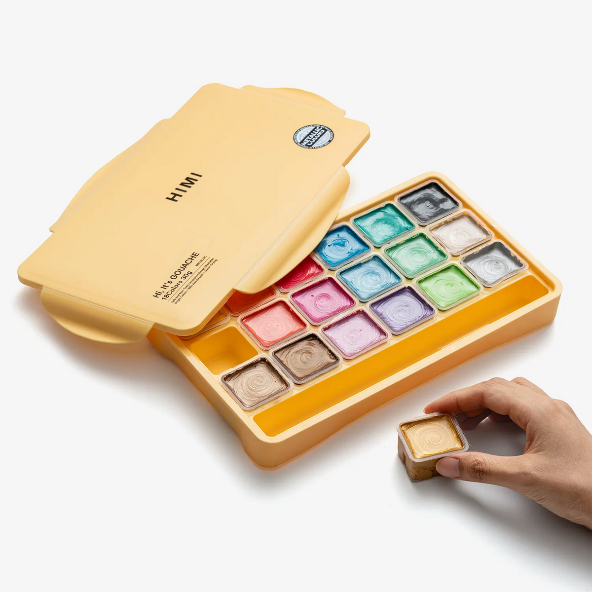 himi-metallic-jelly-gouache-set-18-farben-30g-yellow-case-Verpackung-geoeffnet-mit-Hand